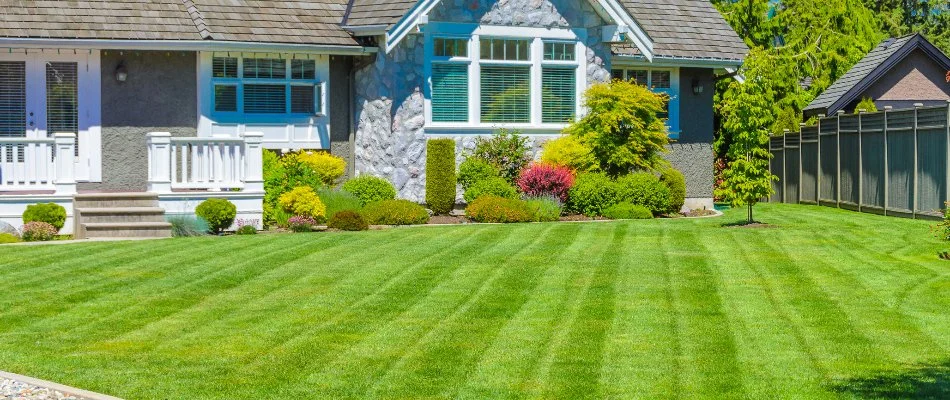 Lawn in Tulsa, OK, with mowing pattern on a house.