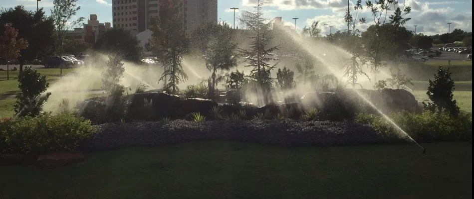 A landscape being watered from an irrigation system in Collinsville, OK.